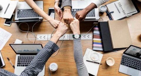 Colleagues giving a fist bump